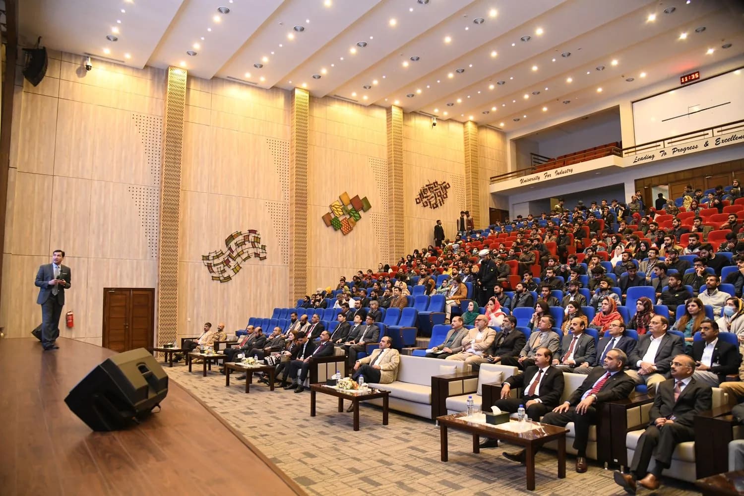 Dr Attiq Ur Rehman addressing a university auditorium.
